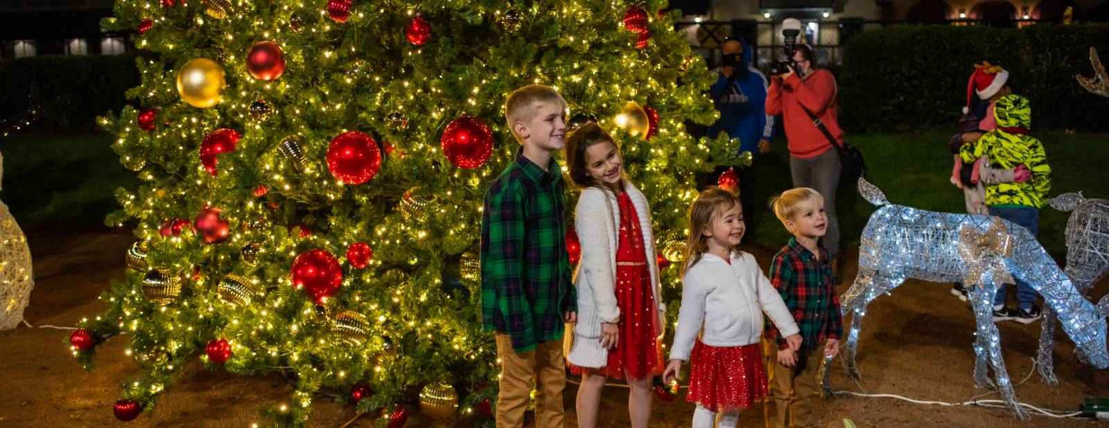Kids in front of Christmas Tree